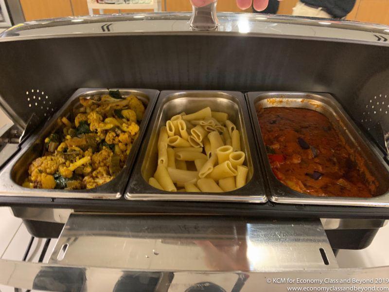 a trays of food in a buffet