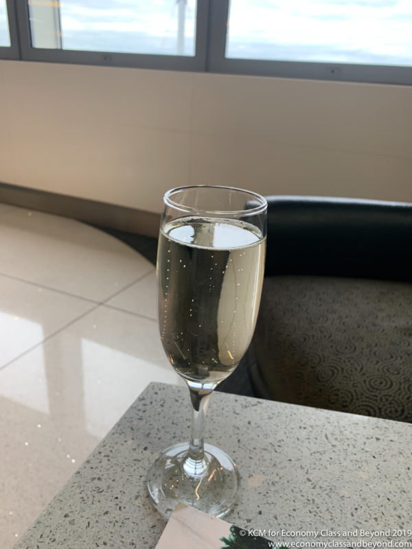 a glass of champagne on a counter