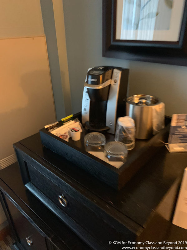 a coffee maker and other items on a table