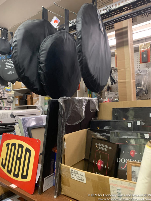 a group of black round objects in a store