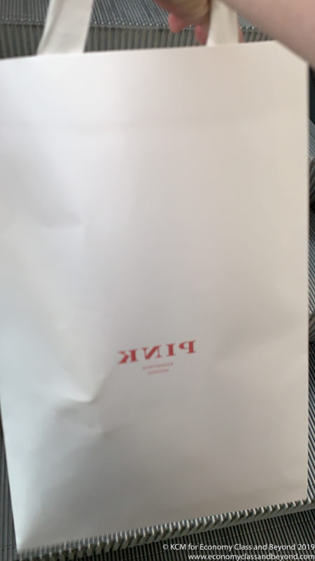 a white bag with red text