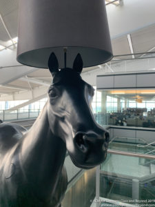 a horse statue with a lamp shade