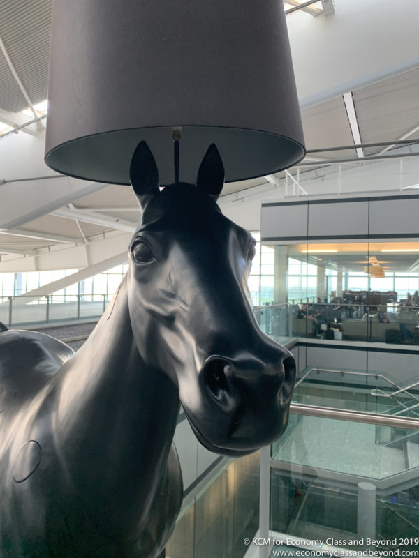 a horse statue with a lamp shade