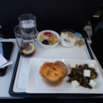 a tray of food and drinks on a plane
