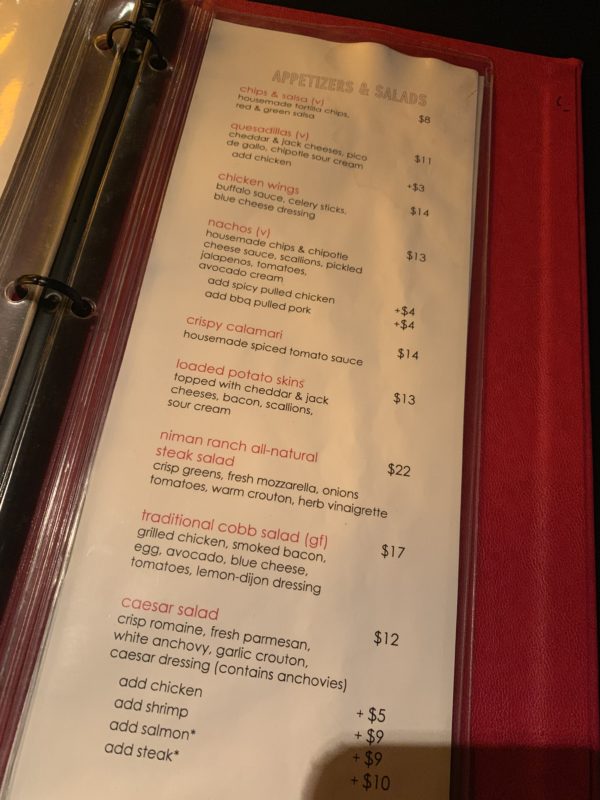 a menu with red text on it