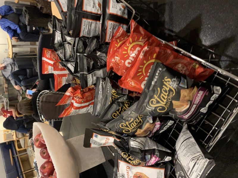 a group of bags of chips on a table