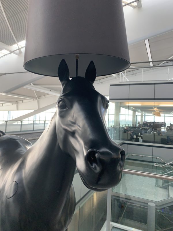a horse lamp with a shade