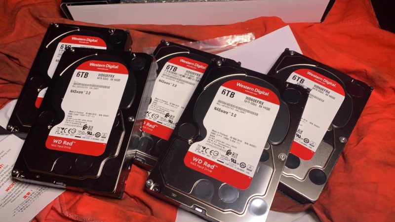 several hard drives on a red and white cloth