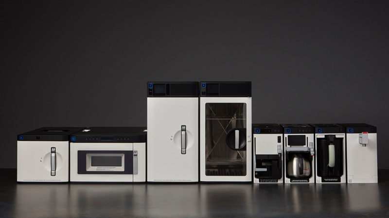 a group of microwaves and coffee machines