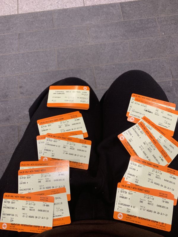 a person's legs with tickets on them