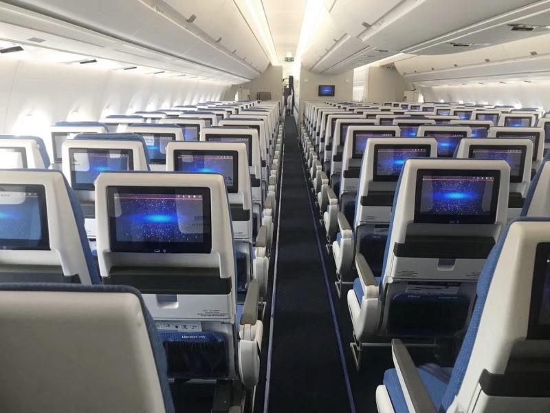 rows of seats with monitors