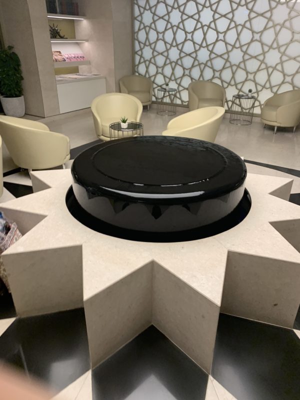 a black and white circular object in a star shaped table