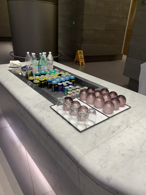 a group of drinks and glasses on a counter