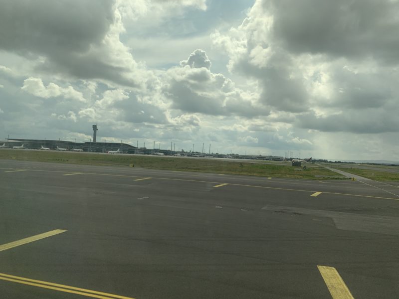 a runway with a cloudy sky