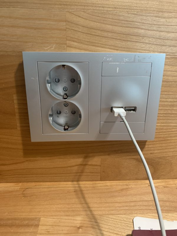 a white cord plugged into a wall outlet
