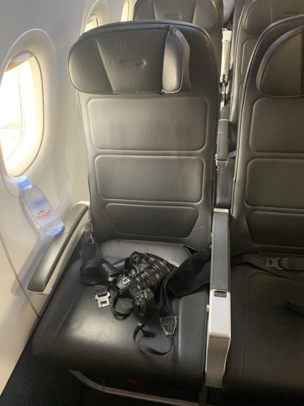 a camera on a seat in a plane