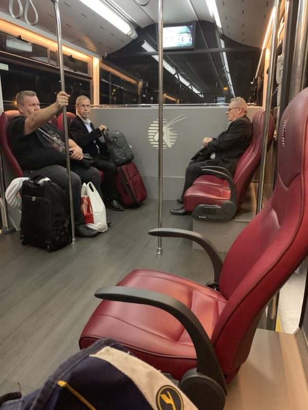 a group of people sitting on a bus