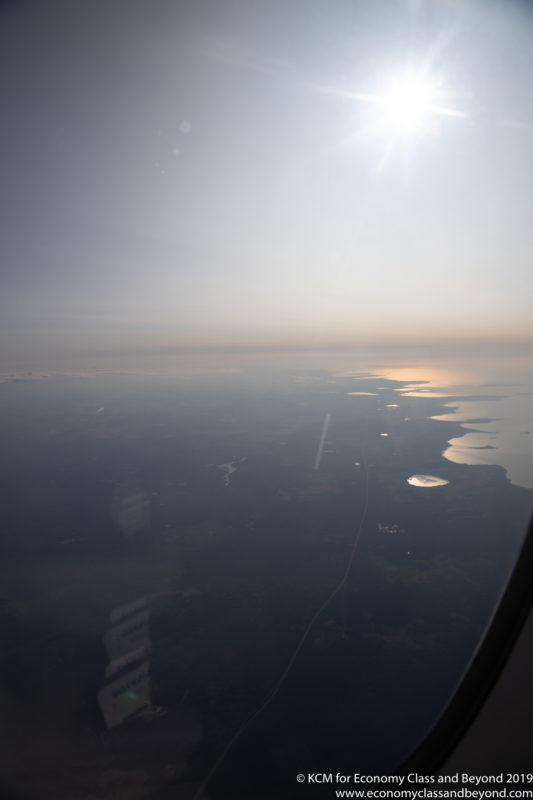 a view of the ocean from an airplane window