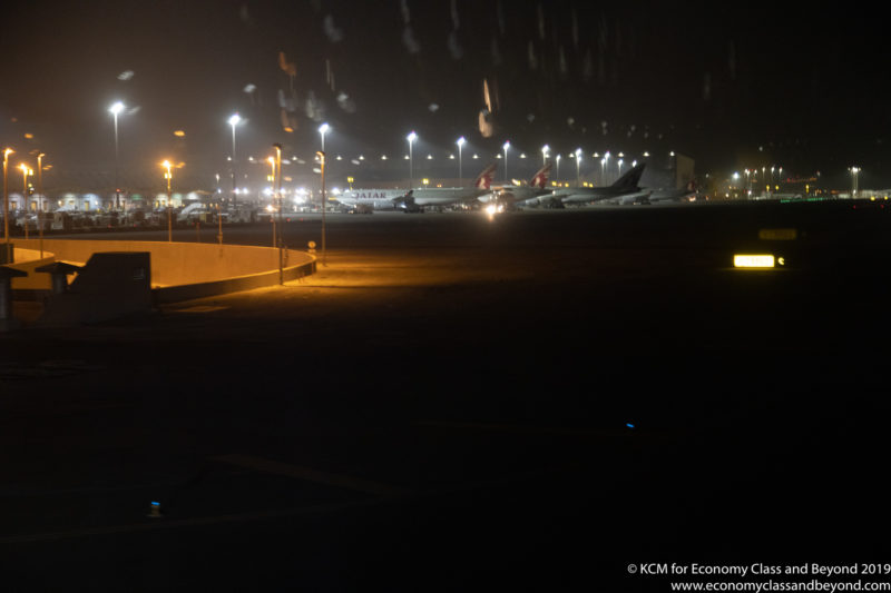 airplanes at night in an airport