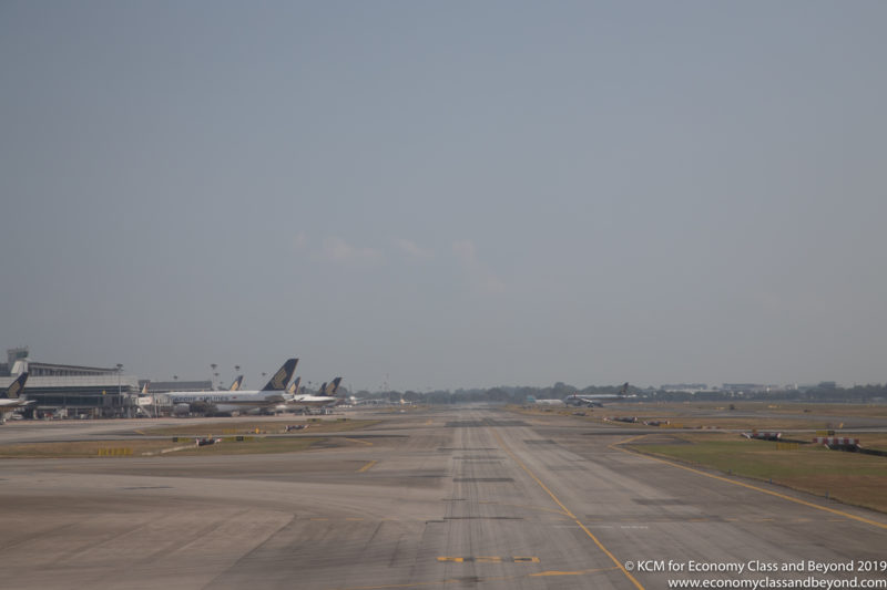 a runway with airplanes on it