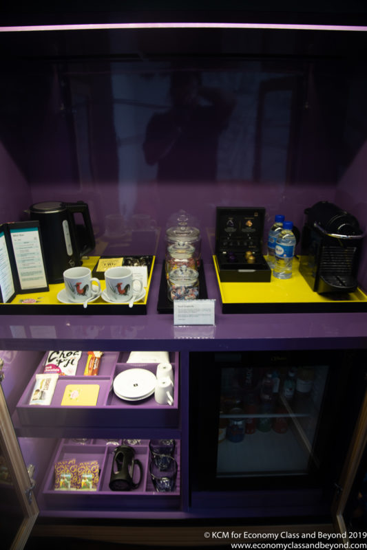 a display of coffee cups and other items