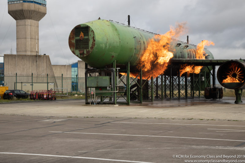 a large green tank on fire