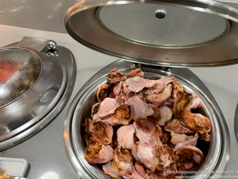 a bowl of bacon on a counter