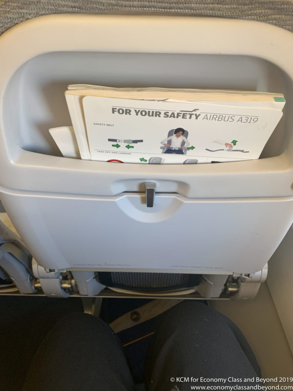 a seat with a safety instructions in it