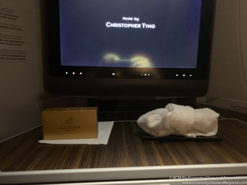 a white towel on a table next to a television