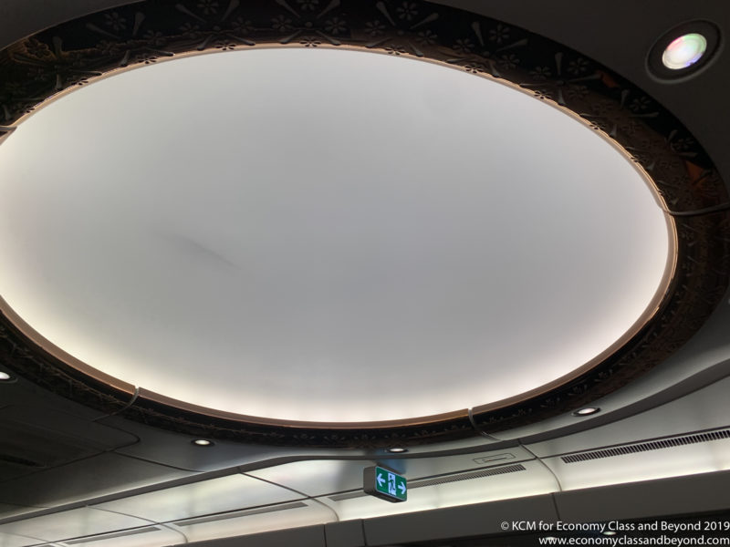 a circular ceiling with a sign