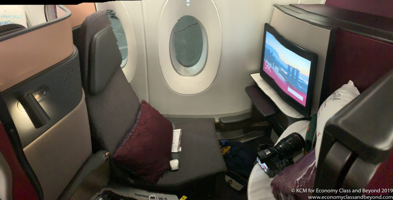 a tv and a chair in a plane
