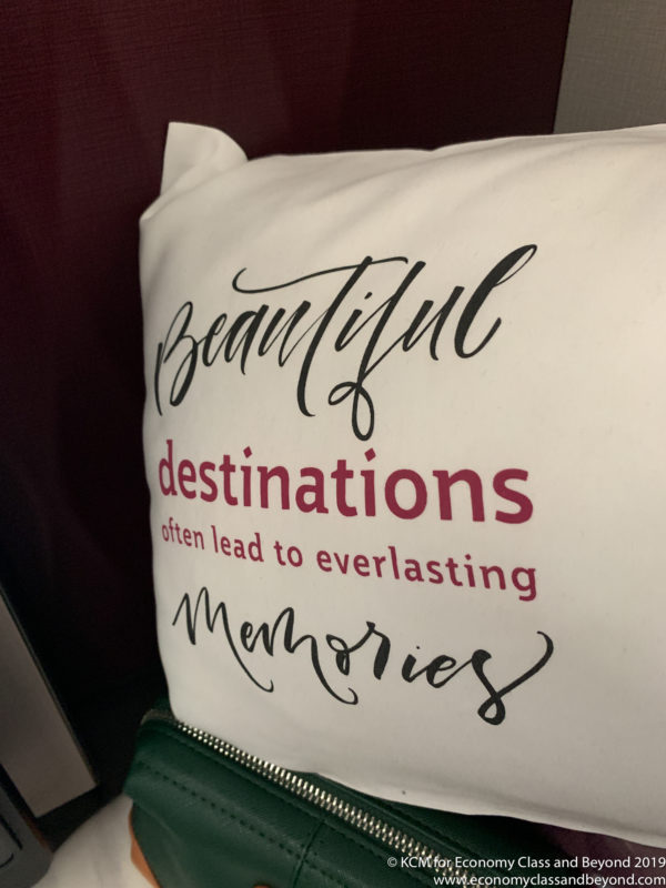 a white pillow with red text on it