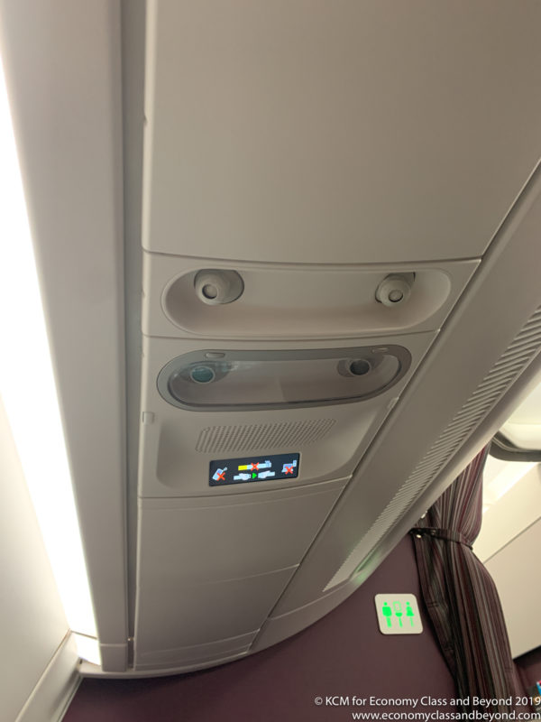 a seat and lights on a plane