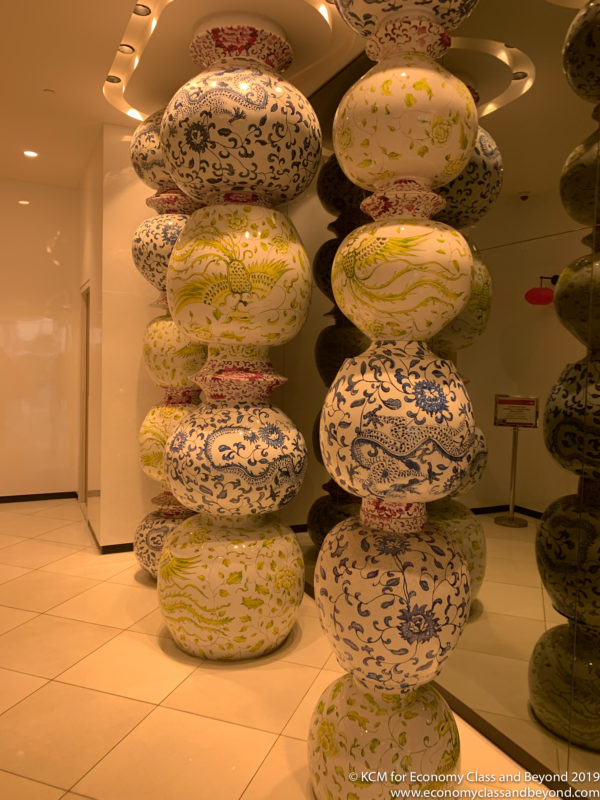 a group of vases stacked in a room