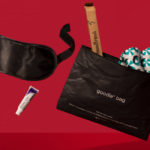 a black bag with a mask and a tube of toothpaste