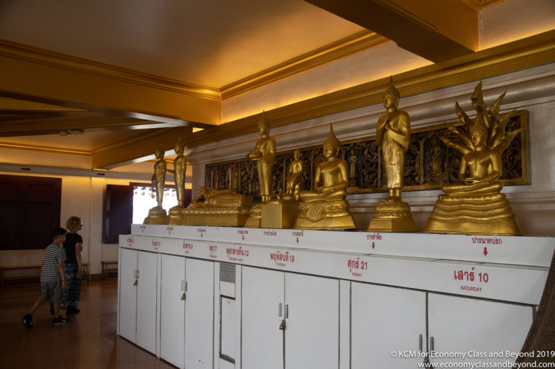 a group of gold statues on a white counter