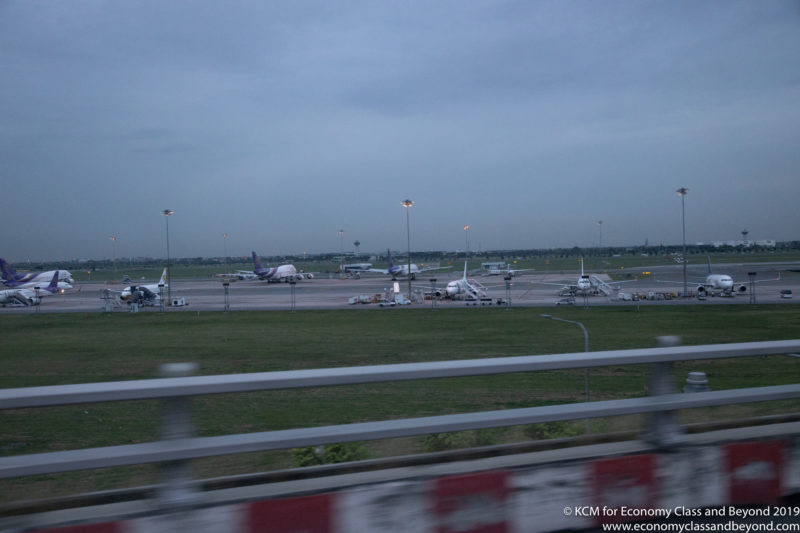 an airport with airplanes on the runway