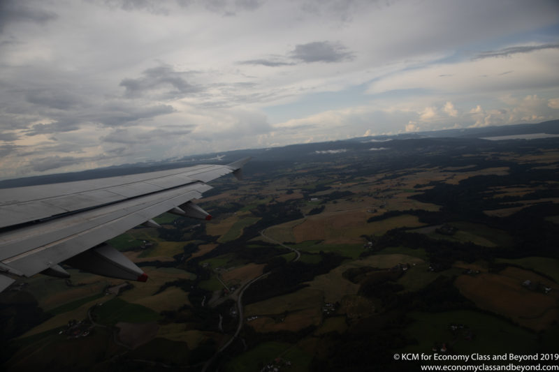 an airplane wing and landscape