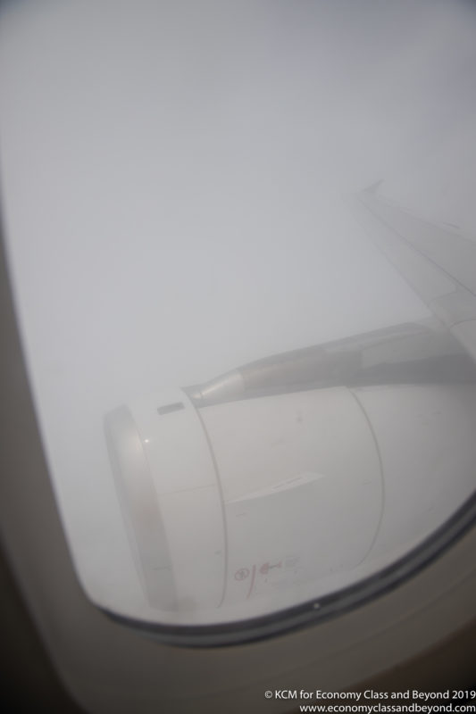 a plane wing in the fog