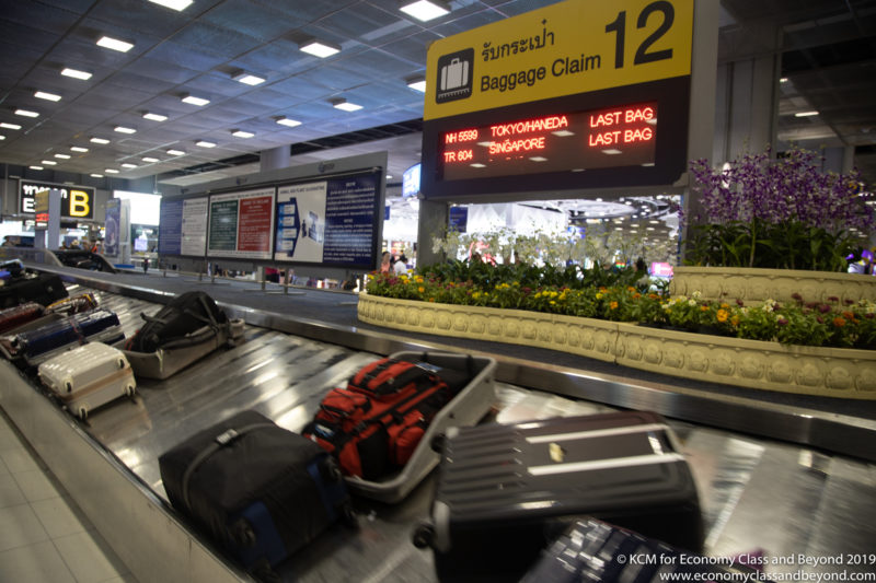 luggage on a conveyor belt at an airport