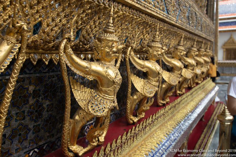 a row of gold statues