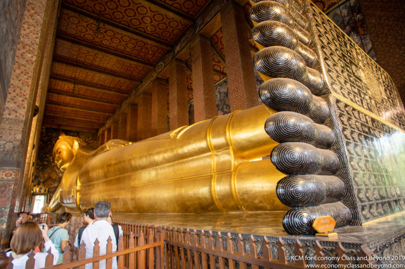 a large gold statue of a buddha
