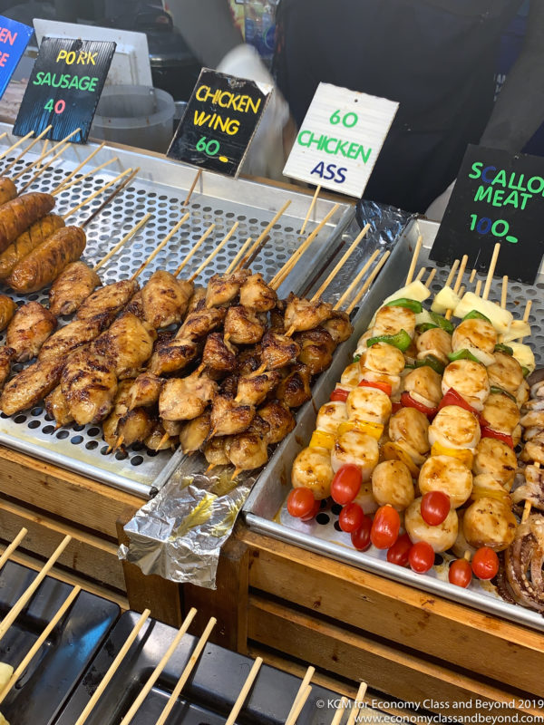 a group of skewers of meat and vegetables