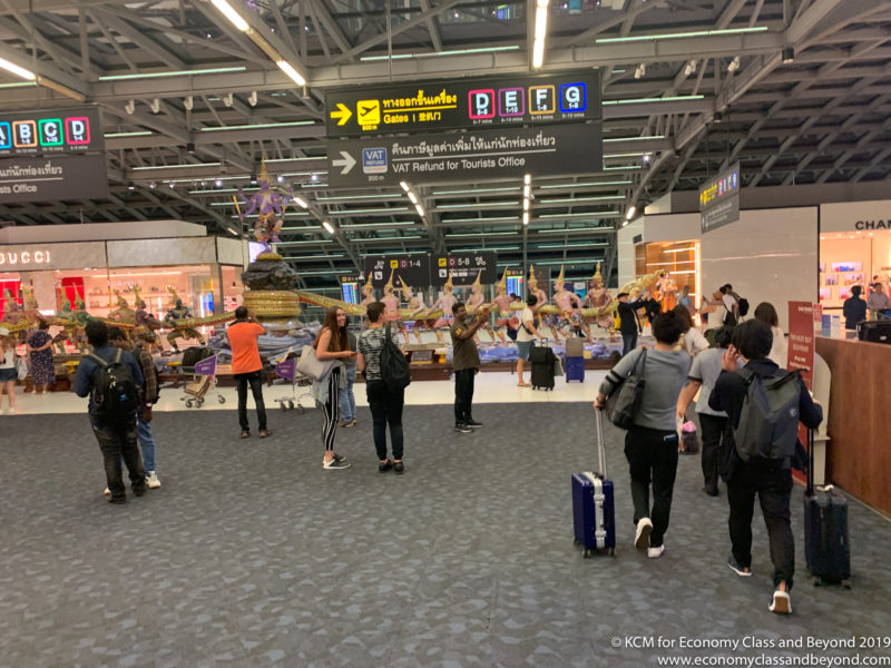 a group of people in a large airport