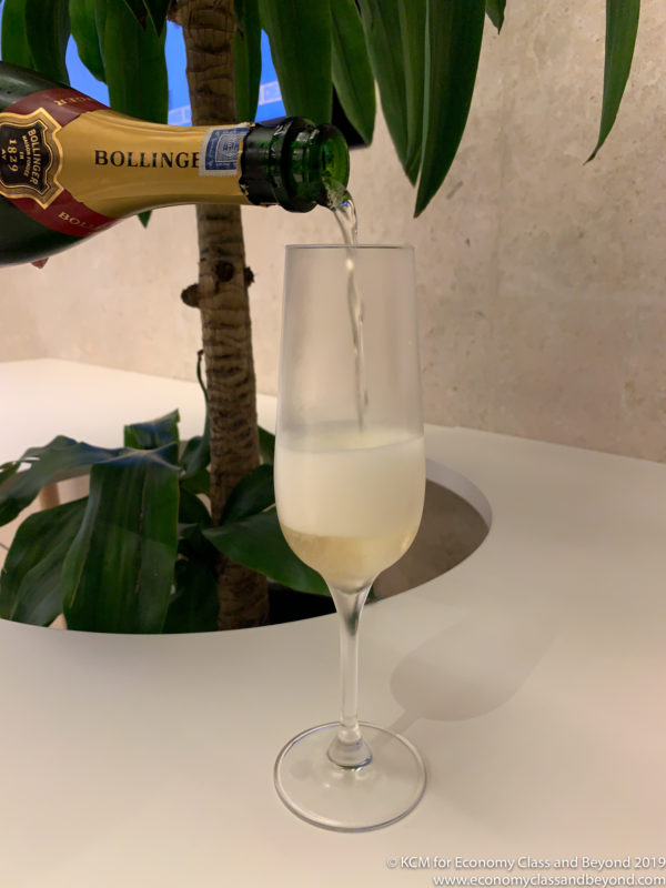 a glass of champagne being poured into a glass