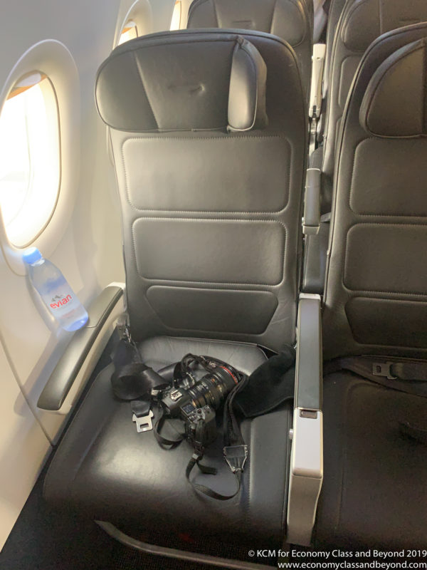 a camera on a seat in a plane