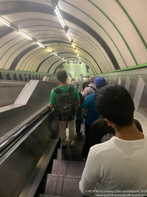 a group of people on an escalator