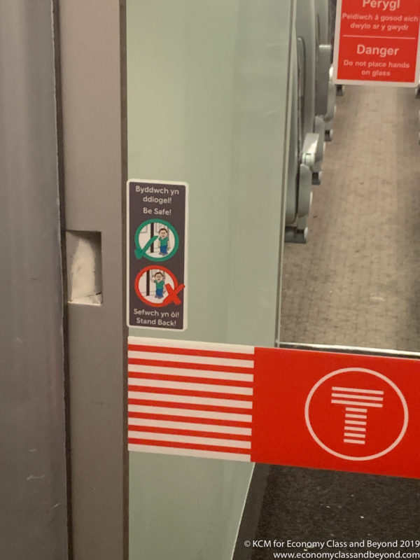 a red and white sign on a train