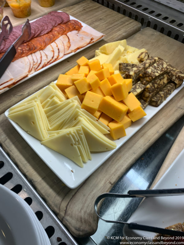 a plate of cheese and meat