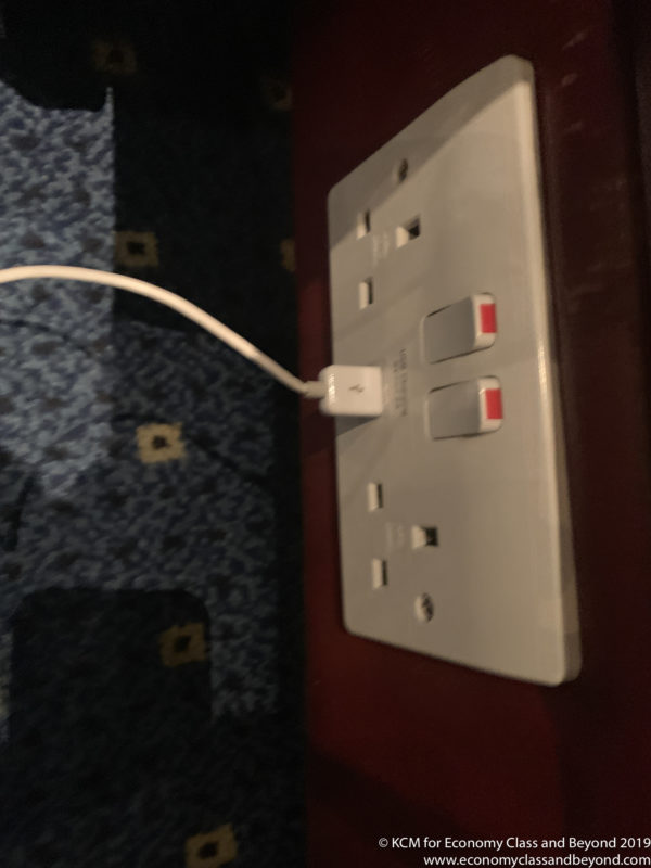 a white electrical outlet with a cord